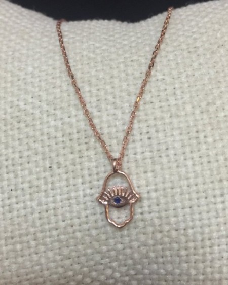 Hamsa evil eye necklace with intricate openwork design, crafted in rose gold plated sterling silver, exuding elegance and symbolism.