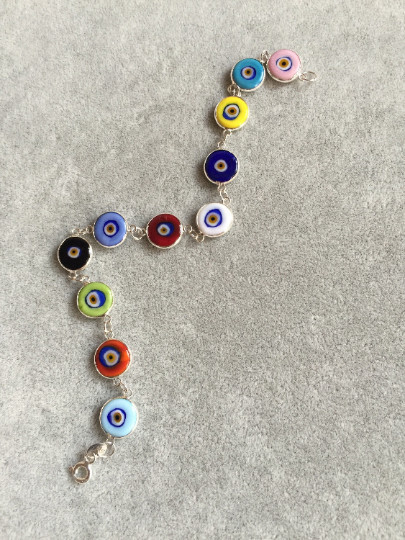Multicolor evil eye bracelet featuring handmade beads connected by sterling silver links, showcasing Turkish craftsmanship, ideal for wholesale buyers.