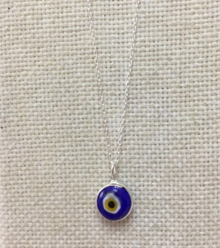 Dark blue evil eye necklace featuring a handmade glass bead pendant on a 925 sterling silver chain. Stylish and symbolic.
