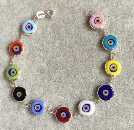 Multicolor evil eye bracelet featuring handmade beads connected by sterling silver links, showcasing Turkish craftsmanship, ideal for wholesale buyers.