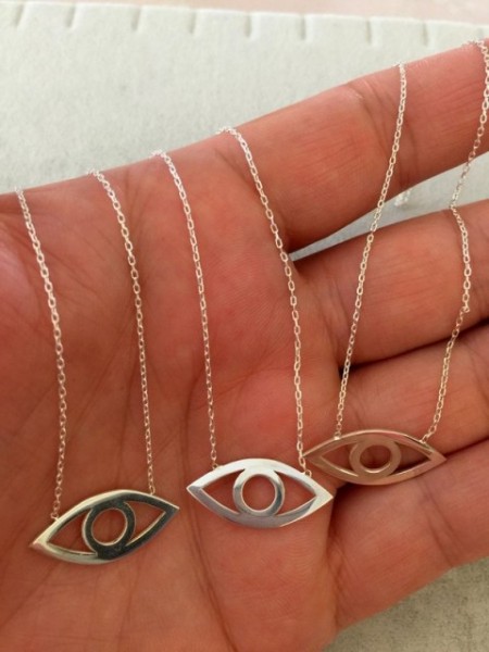 Minimalist gold evil eye necklace with an open-eye design, made from 925 sterling silver, featuring a sleek and elegant look.