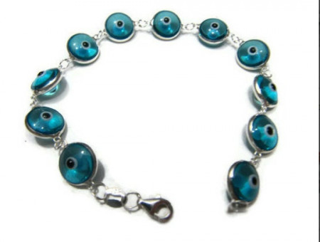 Blue glass evil eye bracelet with sterling silver links, featuring Turkish design, available for wholesale jewelry buyers.