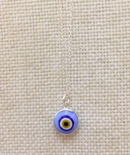 Blue Turkish evil eye necklace with a 925 sterling silver chain and a handcrafted blue glass bead pendant.