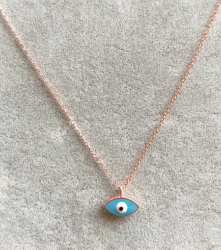 Turquoise evil eye mini necklace with a sterling silver chain and enamel pendant design.