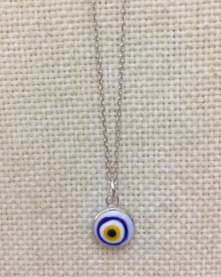 Turkish white evil eye bead necklace on a sterling silver chain, featuring a handcrafted symbolic design.
