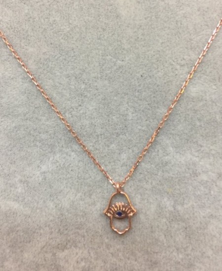 Hamsa evil eye necklace with intricate openwork design, crafted in rose gold plated sterling silver, exuding elegance and symbolism.