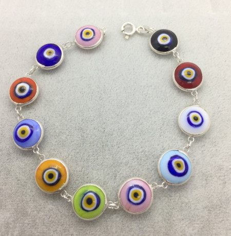 Multicolor evil eye bracelet with sterling silver links, featuring handcrafted Turkish design and vibrant glass beads, perfect for wholesale jewelry collections.