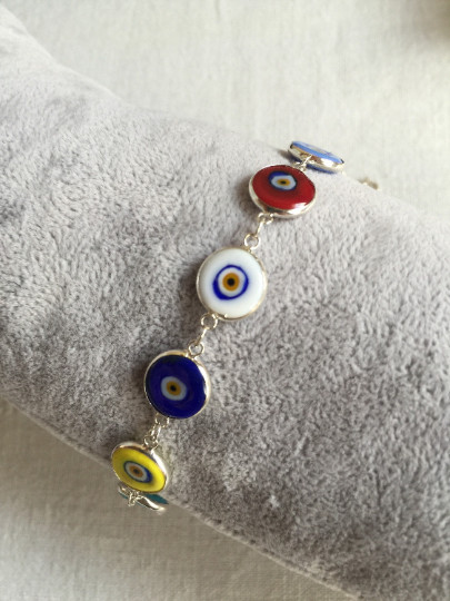 Multicolor evil eye bracelet featuring handmade beads connected by sterling silver links, showcasing Turkish craftsmanship, ideal for wholesale buyers.
