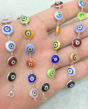Multicolor evil eye bracelet with sterling silver links, featuring handcrafted Turkish design and vibrant glass beads, perfect for wholesale jewelry collections.