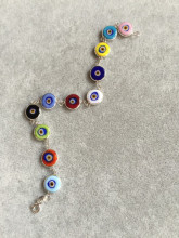 Multicolor evil eye bracelet featuring handmade beads connected by sterling silver links, showcasing Turkish craftsmanship, ideal for wholesale buyers.