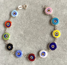 Multicolor evil eye bracelet featuring handmade beads connected by sterling silver links, showcasing Turkish craftsmanship, ideal for wholesale buyers.