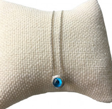Sterling silver necklace featuring a round blue beaded evil eye pendant, minimalist design.