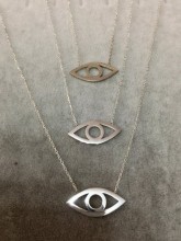 Minimalist gold evil eye necklace with an open-eye design, made from 925 sterling silver, featuring a sleek and elegant look.