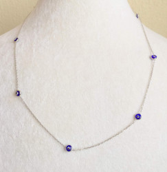 Dark blue evil eye beaded Turkish silver necklace on a delicate sterling silver chain, blending tradition and elegance.