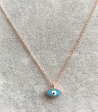 Turquoise evil eye mini necklace with a sterling silver chain and enamel pendant design.