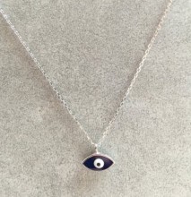 Black evil eye mini necklace with a sterling silver chain and sleek pendant design.
