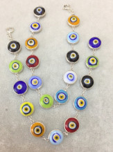 Multicolor evil eye bracelet with sterling silver links, featuring handcrafted Turkish design and vibrant glass beads, perfect for wholesale jewelry collections.