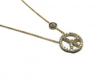 Peace sign necklace with an evil eye charm, made from 925 sterling silver, featuring sparkling stones and a meaningful design.