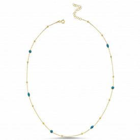 Gold-plated sterling silver necklace with round and oval blue evil eye charms, offering a blend of elegance and traditional symbolism.