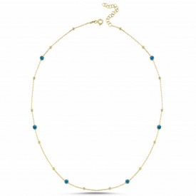 Gold-plated sterling silver necklace adorned with small blue evil eye charms, designed for elegance and spiritual significance.