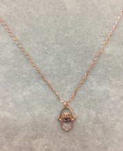 Hamsa evil eye necklace with intricate openwork design, crafted in rose gold plated sterling silver, exuding elegance and symbolism.