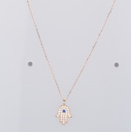Hamsa Hand of Fatima necklace with an evil eye charm, handmade from 925 sterling silver, adorned with clear and blue cubic zirconia stones.