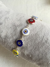 Multicolor evil eye bracelet featuring handmade beads connected by sterling silver links, showcasing Turkish craftsmanship, ideal for wholesale buyers.