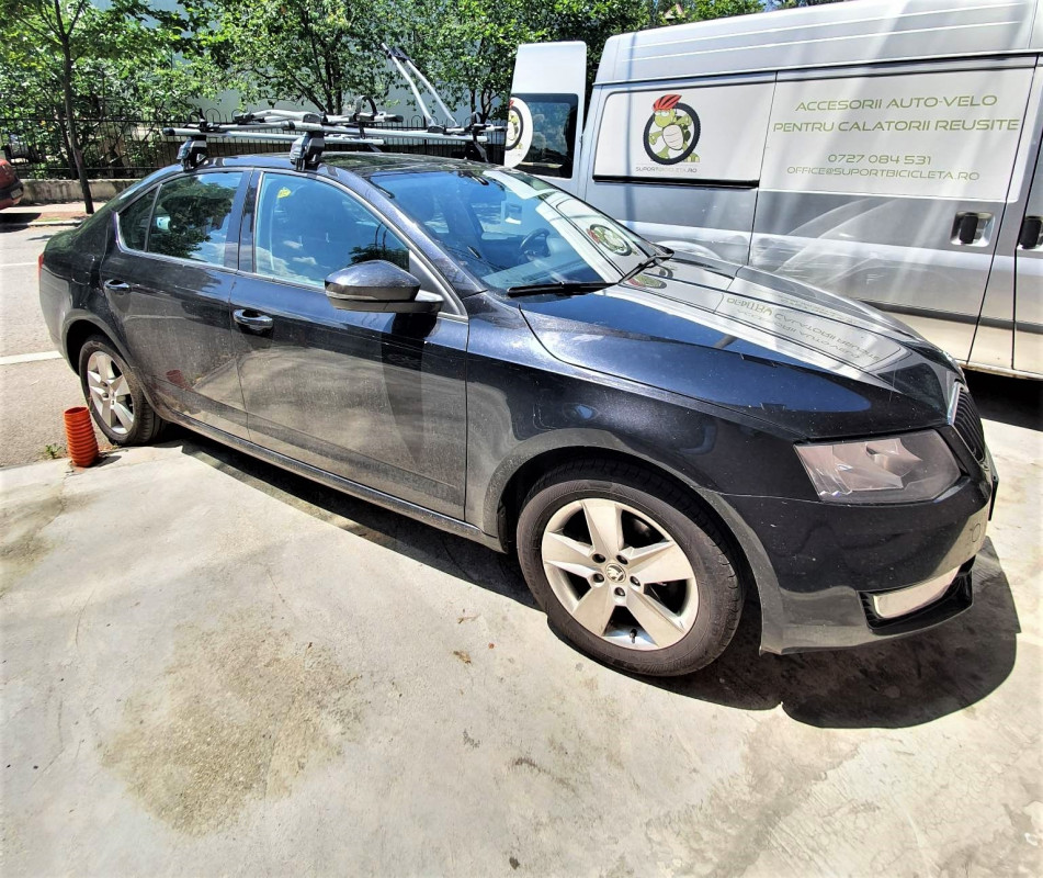 Skoda Octavia bare transversale Menabo Tema si suporturi de bicicleta Thule FreeRide 532