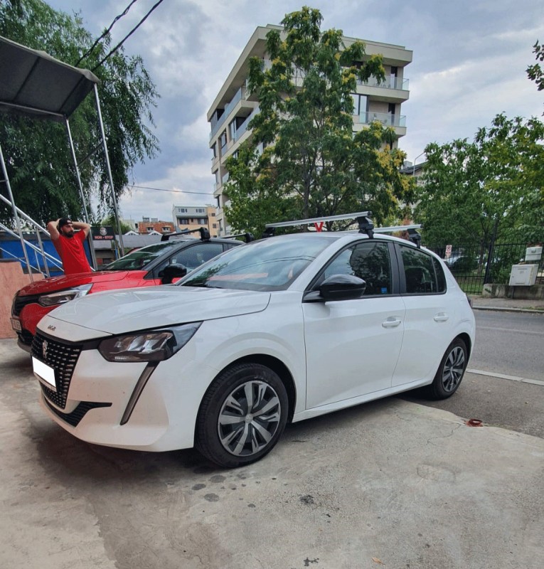 Peugeot 208 bare transversale Menabo Omega