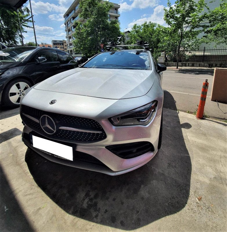 Mercedes-Benz CLA with Menabo Tema roof bars and two Thule ProRide 598 bike racks