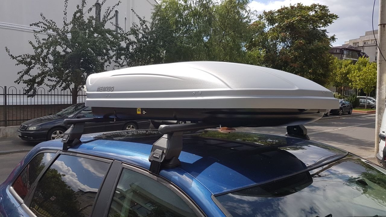 Audi A3 with Menabo Tema roof bars and a Menabo Mania roof box