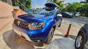 Dacia Duster II (HM) cu bare transversale Menabo Brio si cutie portbagaj Menabo Mania 460 Black