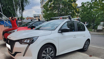 Peugeot 208 bare transversale Menabo Omega