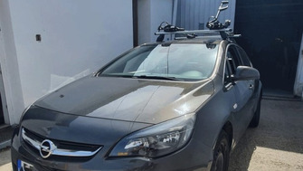 Opel Astra bare transversale Menabo Tema si suporturi de bicicleta Thule ProRide 598