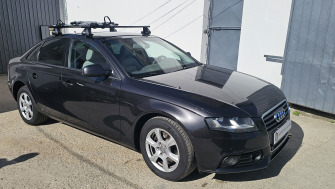 Audi A4 cu bare transversale Thule SquareBar Clamp si suport bicicleta Thule FreeRide