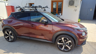 Nissan Juke cu bare transversale Thule SlideBar Clamp si suport bicicleta Thule ProRide 598 Silver