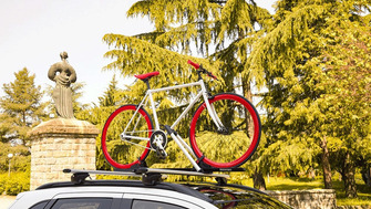 Bike racks: on the roof bars or on the towbar?
