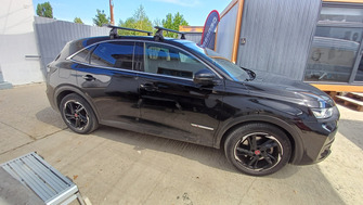Citroen DS7 with Menabo Omega Plus Black roof bars and a Menabo Marathon Dark 400 roof box