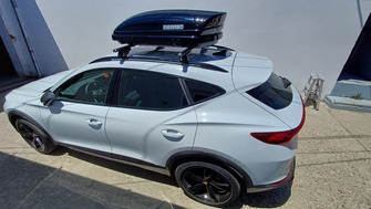 Cupra Formentor 2020+ with Menabo Tiger Black roof bars and a Menabo Mania 320 ABS Black roof box