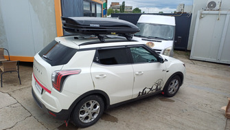 Ssangyong Tivoli 2015+ with Menabo Tiger Black roof bars and a Menabo Mania 460 ABS Black roof box