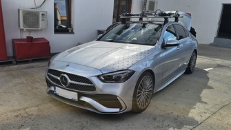 Mercedes C Class with Thule Evo Clamp Silver roof bars and Thule ProRide 598 bike racks