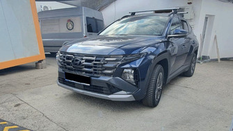 Hyundai Tucson with Thule Evo Clamp Silver roof bars