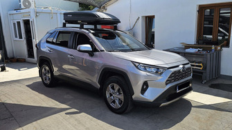 Toyota RAV4 with Menabo Dedicate OE roof bars and a Menabo Marathon Dark 400 roof box