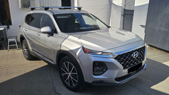 Hyundai Santa Fe with Menabo Lince Silver XL roof bars