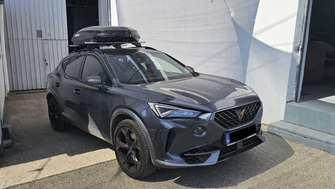Cupra Formentor with Menabo Leopard Silver roof bars and a Menabo Diamond 450 Black roof box