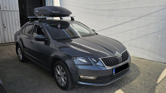 Skoda Octavia with Menabo Omega aluminium roof bars and a Menabo Marathon Dark 400 roof box