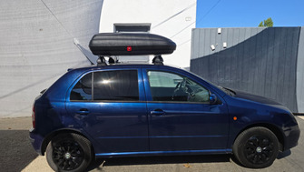 Skoda Fabia with Green Valley steel roof bars and a Carbon Look roof box