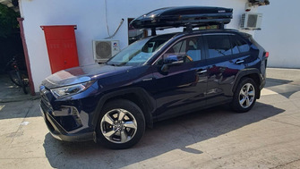 Toyota RAV4 with a Menabo Mania 580 Black roof box