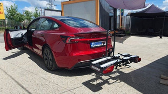 Tesla Model 3 with a Menabo Antares 2 foldable towbar bike rack