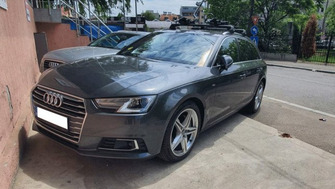 Audi A4 with Thule Evo Flush Edge roof bars and two Thule ProRide 598 bike racks